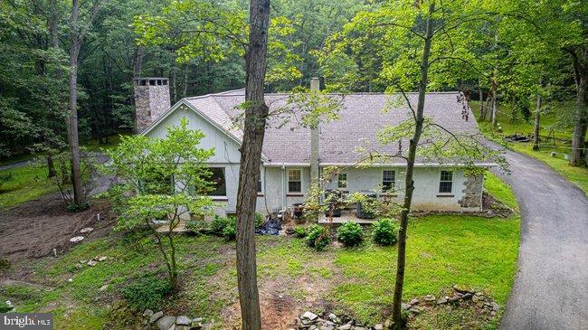 10246 Golf Course Road Fayetteville, PA 17222 - Photo 51 of 62 a view of a house with backyard and garden