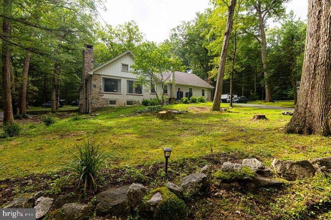 10246 Golf Course Road Fayetteville, PA 17222 - Photo 8 of 62 a front view of a house with a yard