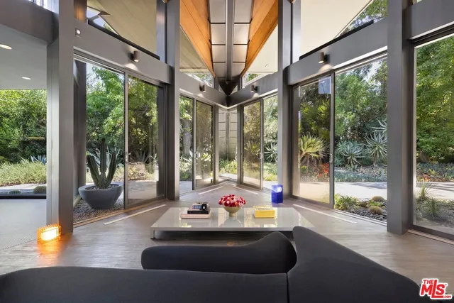 a backyard of a house with a table and chairs