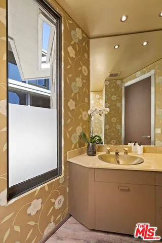 a view of a living room with furniture and wooden floor