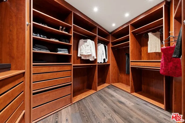 a living room with furniture and large windows