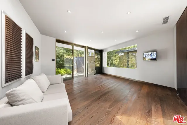 a kitchen with a refrigerator and a sink