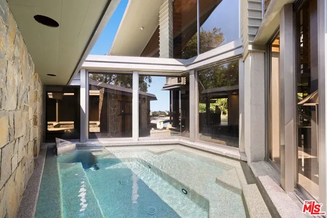 an aerial view of a house with a garden