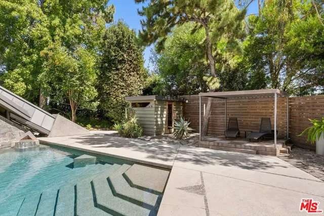 a view of a living room with a floor to ceiling window and floor to ceiling window