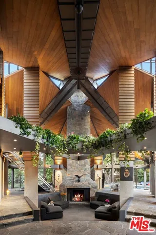 a dining room with a bench and chairs