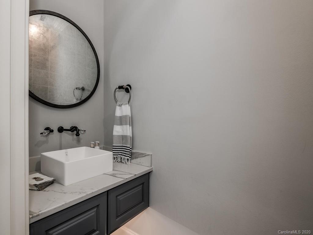 19506 Mary Ardrey Circle Cornelius, NC 28031 - Photo 15 of 36 a bathroom with a sink and a mirror
