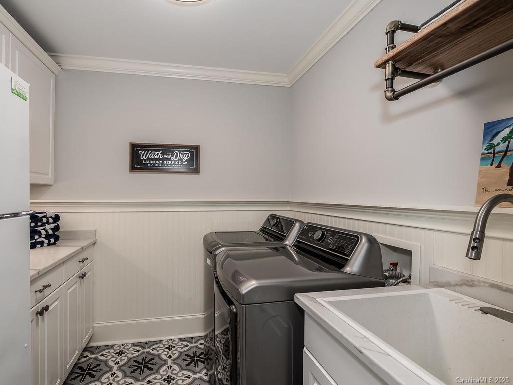 19506 Mary Ardrey Circle Cornelius, NC 28031 - Photo 17 of 36 a utility room with sink dryer and washer