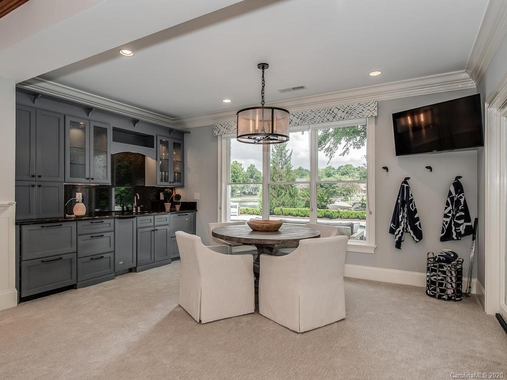 19506 Mary Ardrey Circle Cornelius, NC 28031 - Photo 19 of 36 a kitchen with microwave a stove and refrigerator