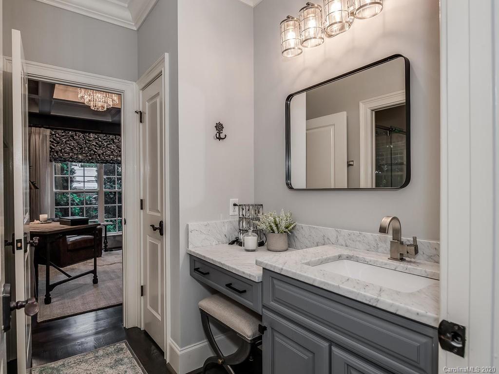 19506 Mary Ardrey Circle Cornelius, NC 28031 - Photo 10 of 36 a en suite bathroom with a granite countertop sink and a mirror