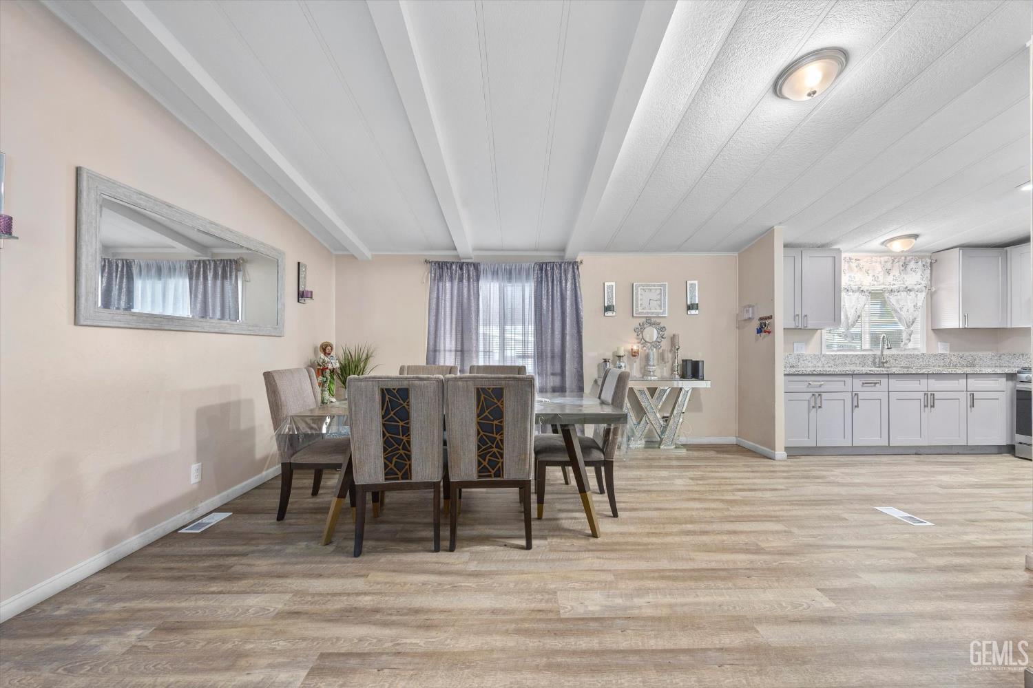 Undisclosed Address Delano, CA 93215 - Photo 13 of 43 a view of a dining room with furniture and wooden floor