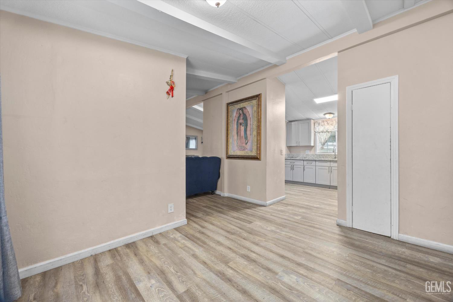 Undisclosed Address Delano, CA 93215 - Photo 22 of 43 a view of wooden floor and windows in a room