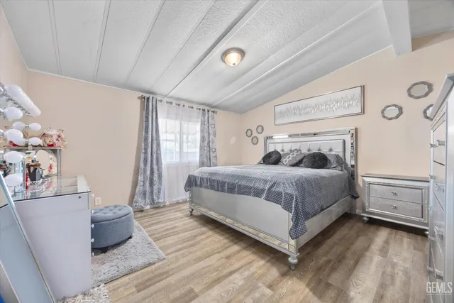 a bedroom with a bed and a dresser