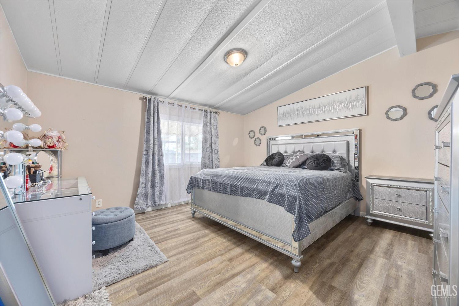 Undisclosed Address Delano, CA 93215 - Photo 23 of 43 a bedroom with a bed and a window