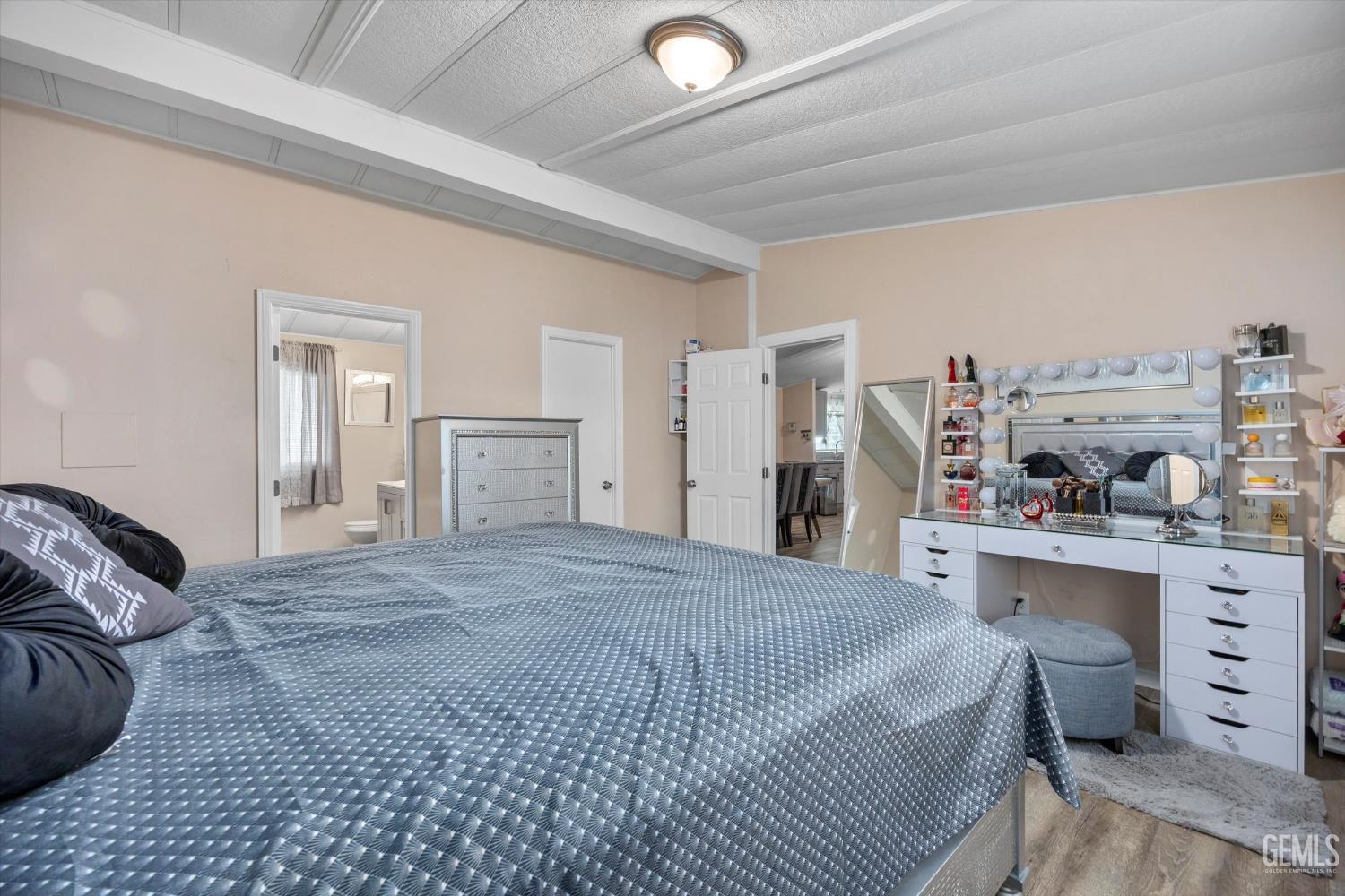 Undisclosed Address Delano, CA 93215 - Photo 25 of 43 a large bedroom with a bed and a cabinets