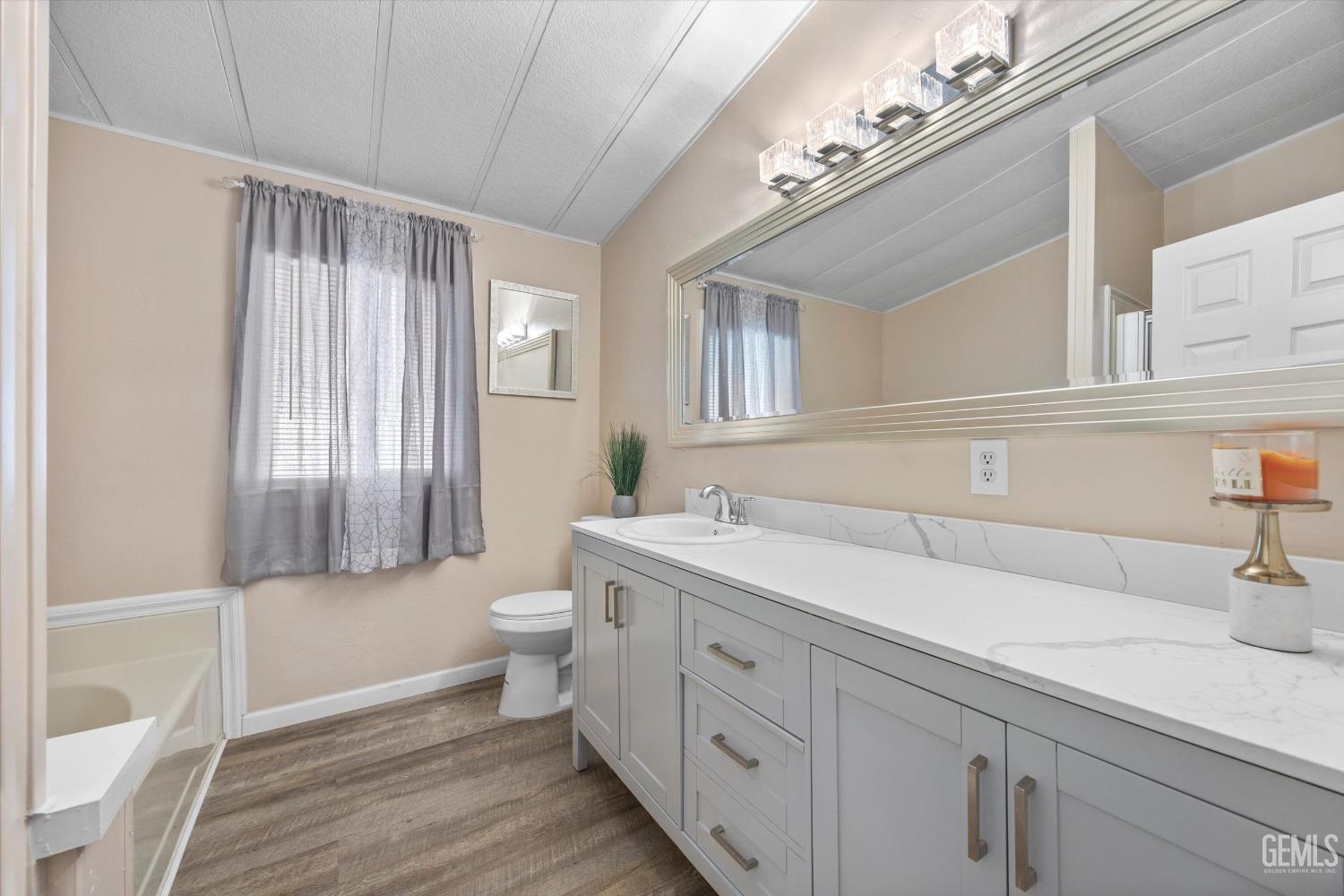 Undisclosed Address Delano, CA 93215 - Photo 26 of 43 a bathroom with a double vanity sink toilet and a tub