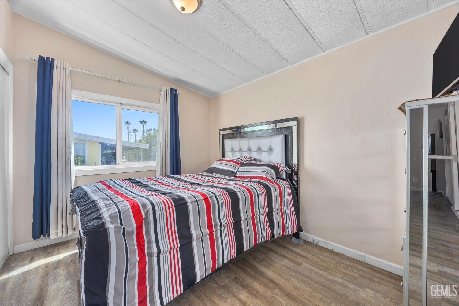 Undisclosed Address Delano, CA 93215 - Photo 28 of 43 a bed sitting in a bedroom next to a window