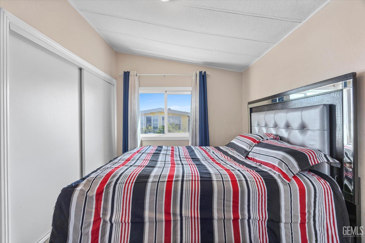 Undisclosed Address Delano, CA 93215 - Photo 29 of 43 a bedroom with a bed and a window