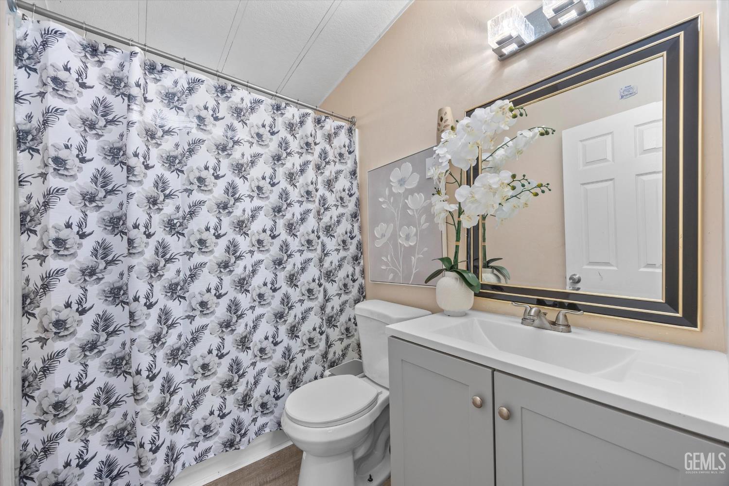 Undisclosed Address Delano, CA 93215 - Photo 30 of 43 a bathroom with a sink toilet and mirror