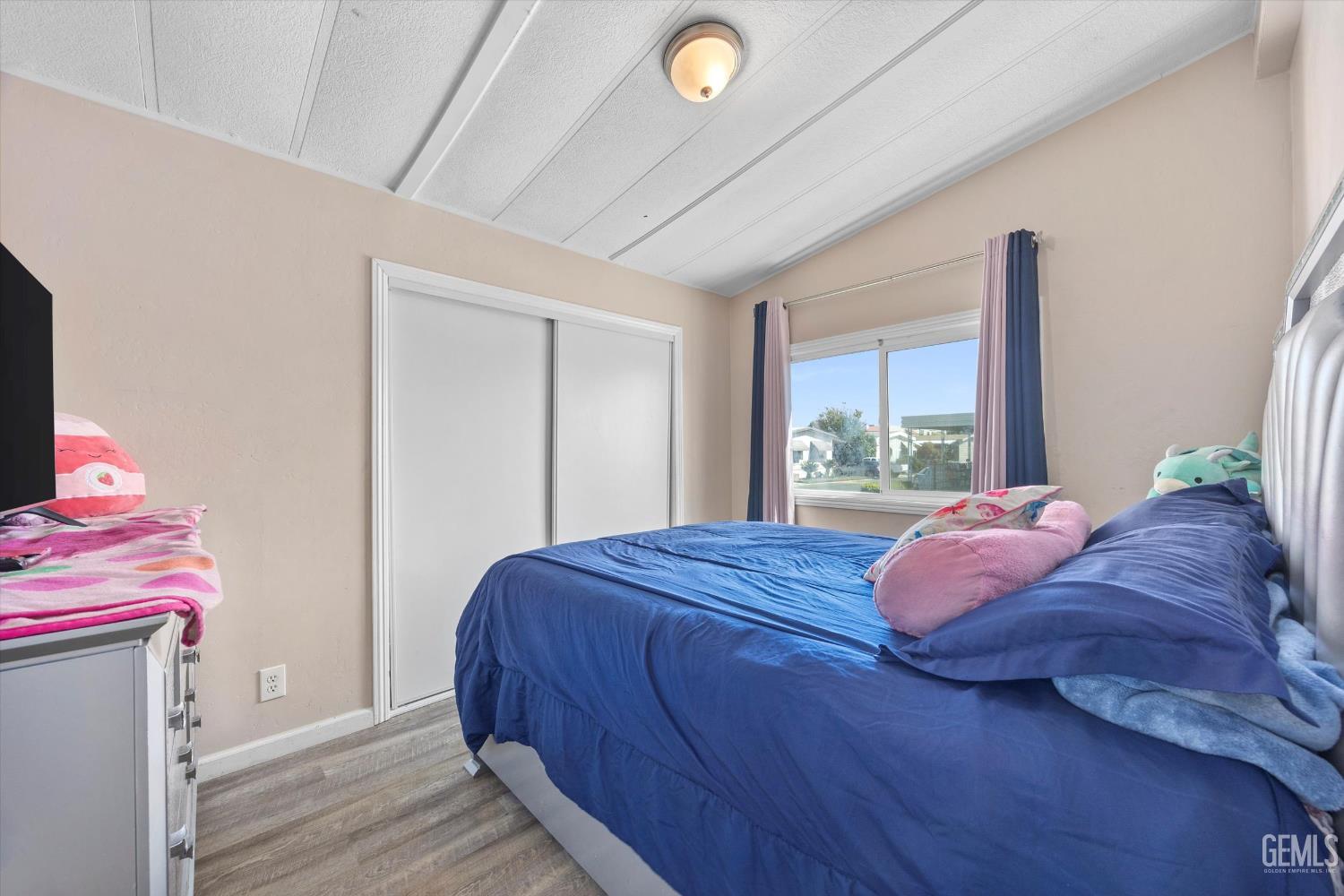 Undisclosed Address Delano, CA 93215 - Photo 31 of 43 a bed sitting in a bedroom next to a window