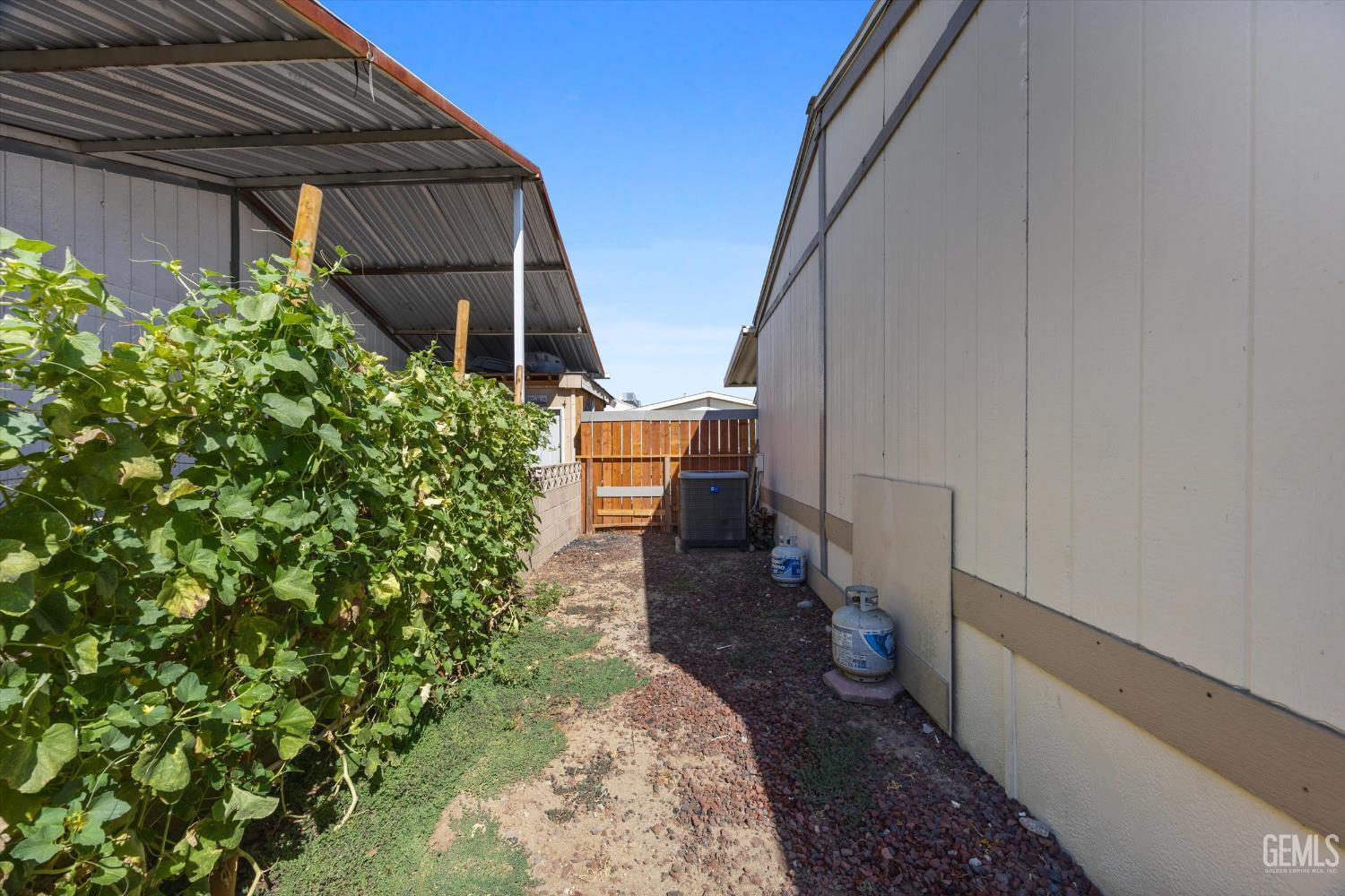 Undisclosed Address Delano, CA 93215 - Photo 37 of 43 a view of a house with a backyard