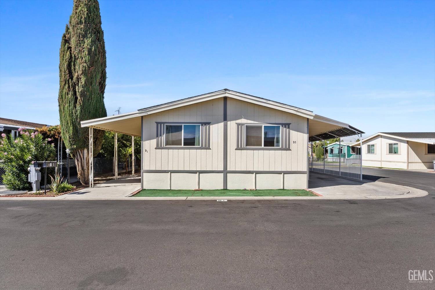 Undisclosed Address Delano, CA 93215 - Photo 5 of 43 a front view of a house with a porch