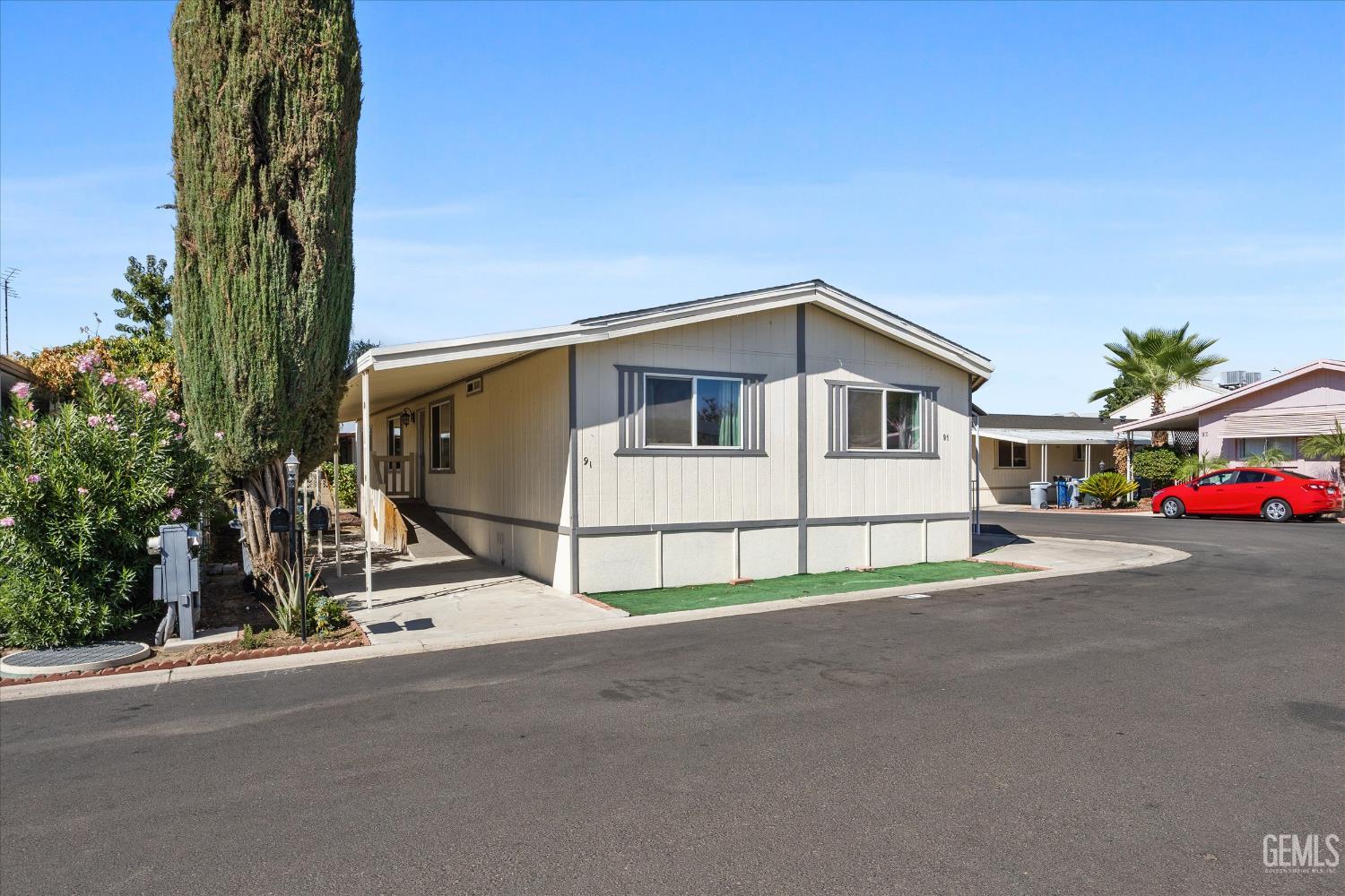 Undisclosed Address Delano, CA 93215 - Photo 6 of 43 a view of a white house with a street