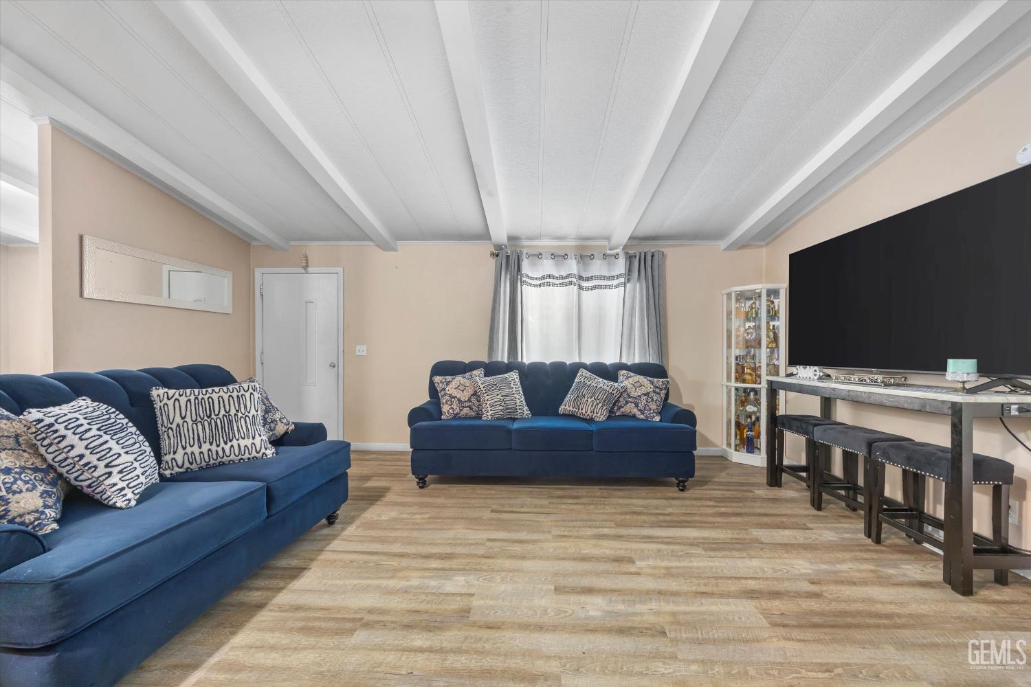 Undisclosed Address Delano, CA 93215 - Photo 10 of 43 a living room with furniture and a flat screen tv