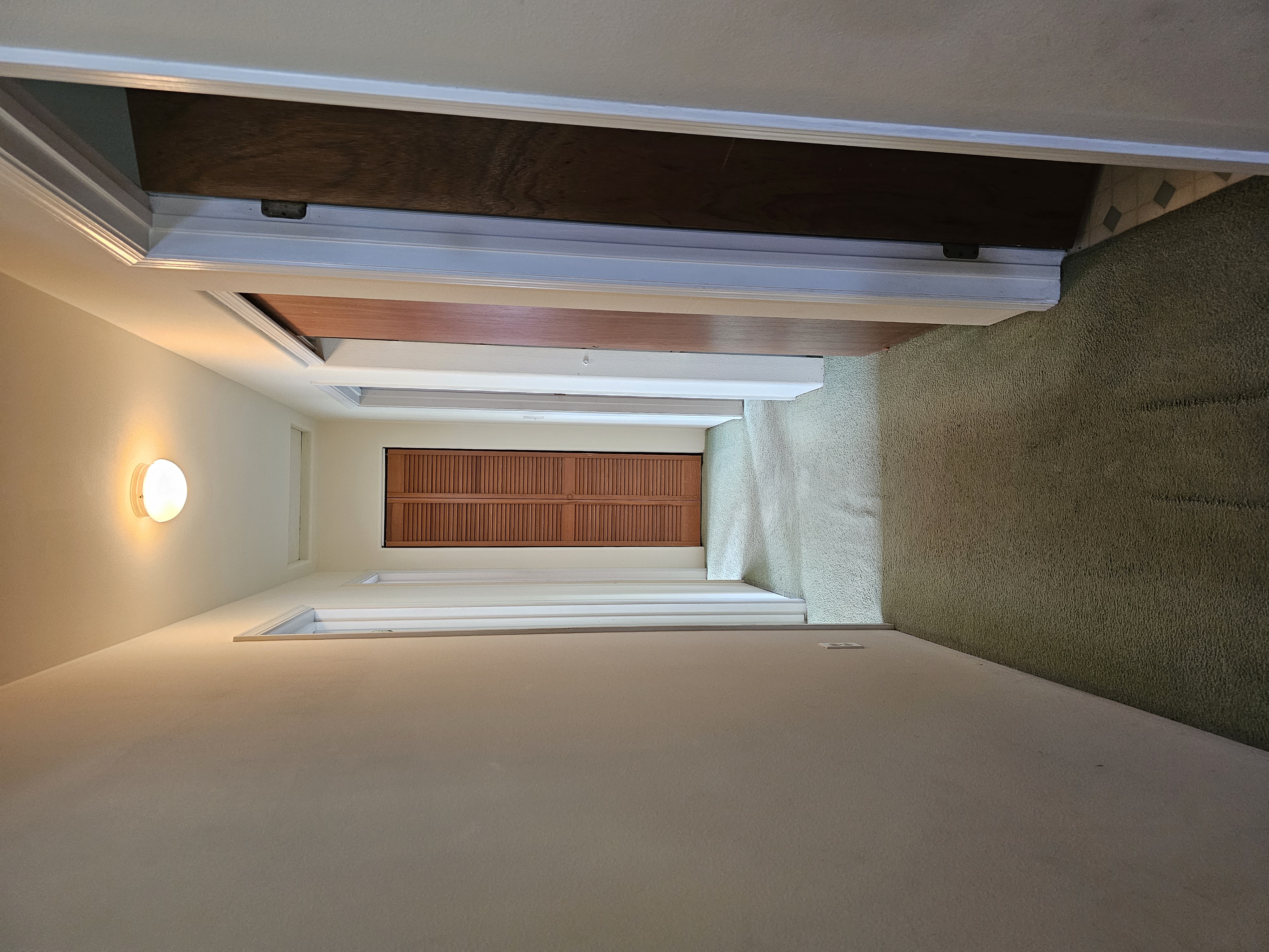 16-1754 Uhini Ana Road Pahoa, HI 96778 - Photo 13 of 21 a view of a hallway with wooden floor and closet area