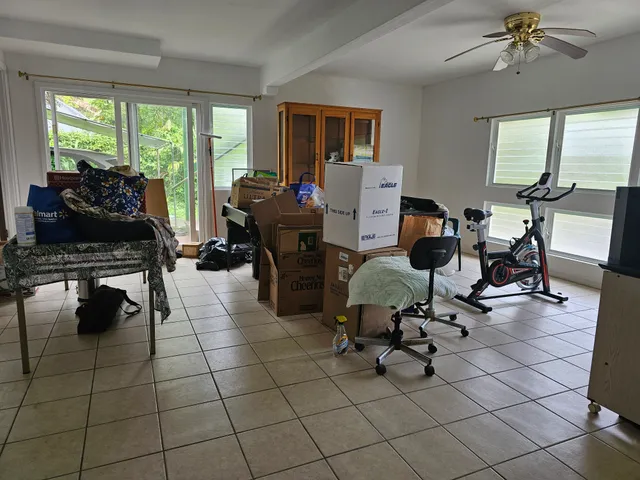 a living room filled with furniture and a chandelier