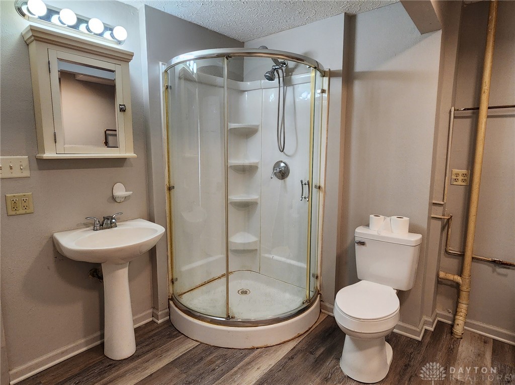 211 Race Street Spring Valley, OH 45370 - Photo 10 of 12 This functional bathroom provides essential amenities for everyday living.