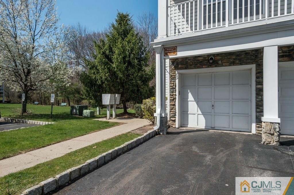 85 Prestwick Way, Unit 85 Edison, NJ 08820 - Photo 16 of 18 a front view of a house with a yard