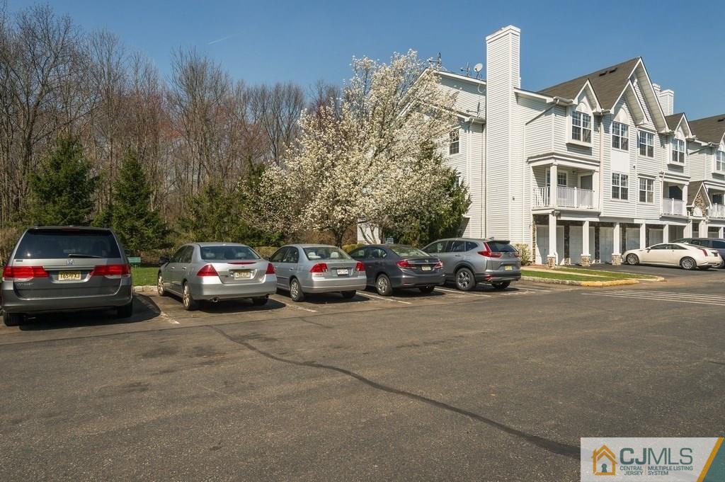 85 Prestwick Way, Unit 85 Edison, NJ 08820 - Photo 18 of 18 a view of a cars park in front of a building