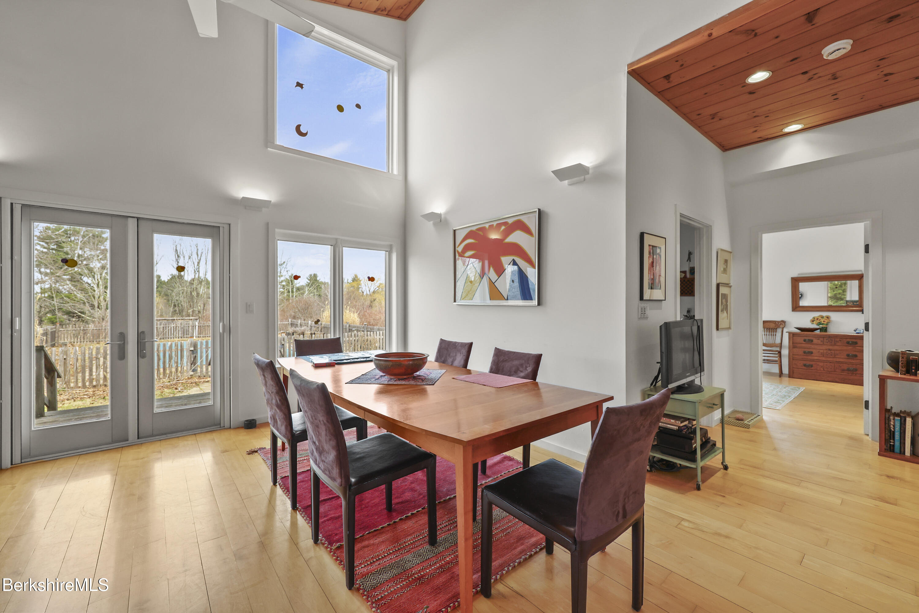 123 Jug End Road Egremont, MA 01230 - Photo 13 of 28 a view of a dining room with furniture and a potted plant