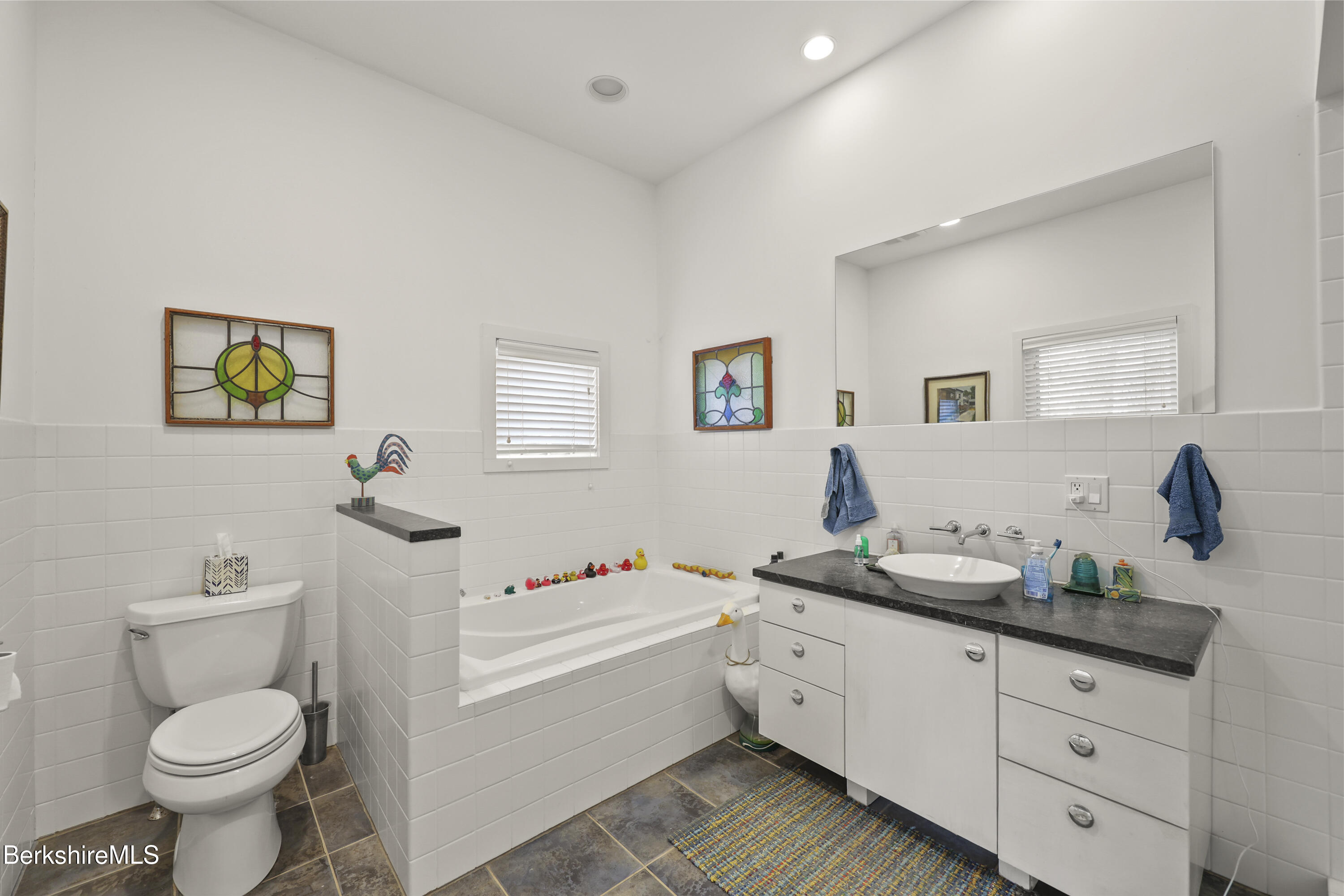 123 Jug End Road Egremont, MA 01230 - Photo 17 of 28 a bathroom with a granite countertop toilet sink and mirror