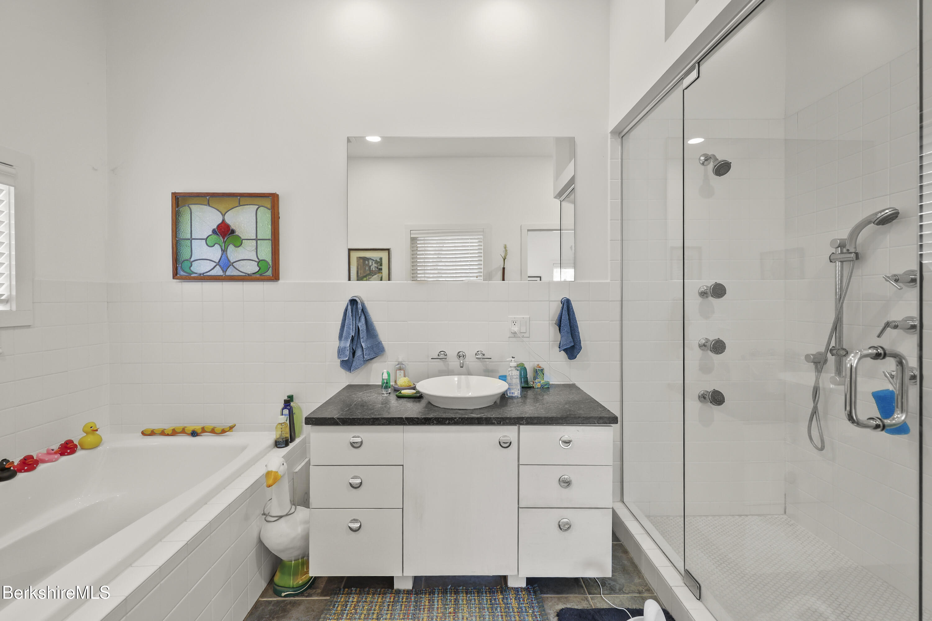 123 Jug End Road Egremont, MA 01230 - Photo 18 of 28 a bathroom with a tub sink and mirror