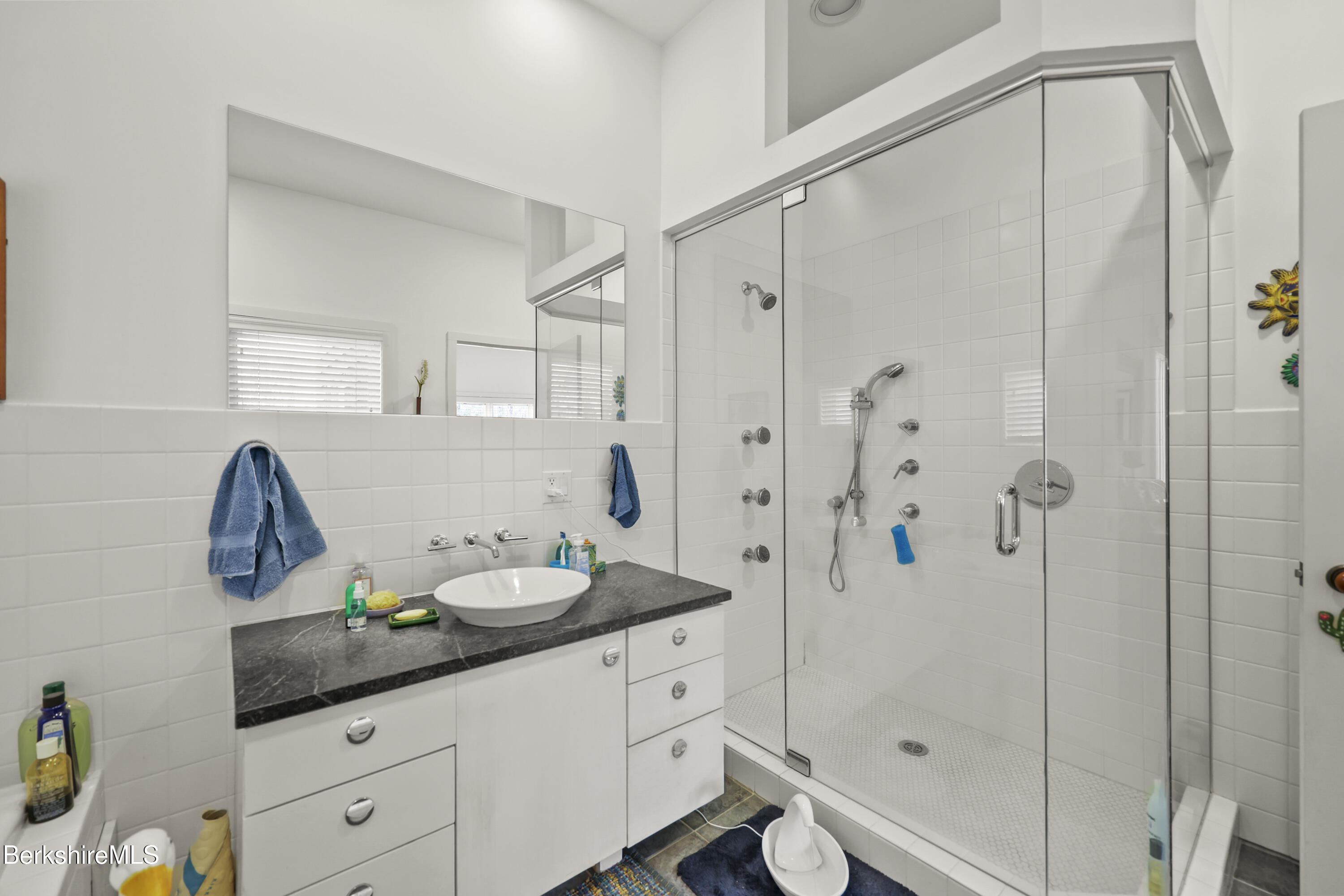 123 Jug End Road Egremont, MA 01230 - Photo 19 of 28 a bathroom with a granite countertop sink a toilet and shower