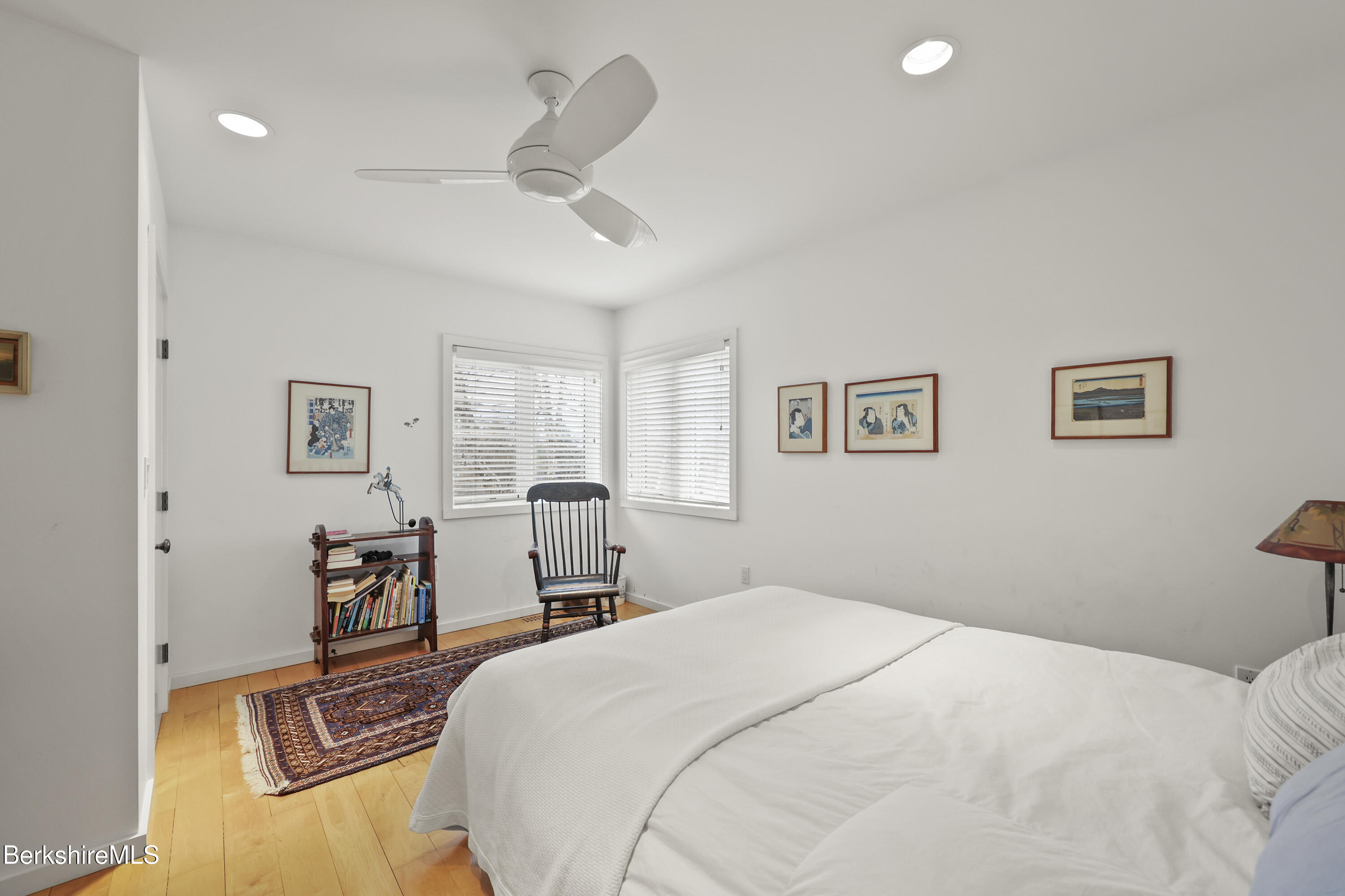 123 Jug End Road Egremont, MA 01230 - Photo 25 of 28 a bedroom with a large bed and a chandelier
