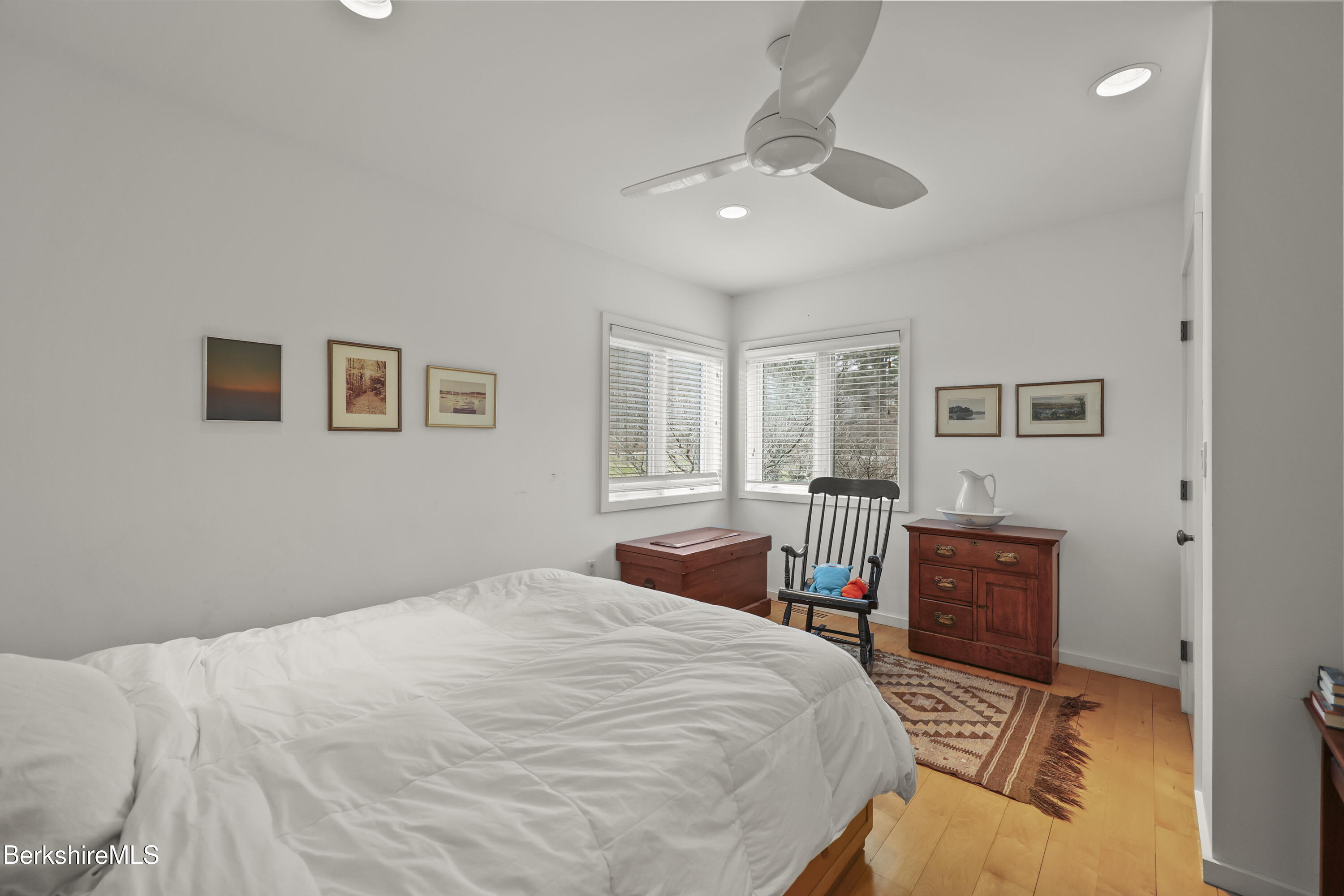123 Jug End Road Egremont, MA 01230 - Photo 27 of 28 a bedroom with a large bed and a chandelier