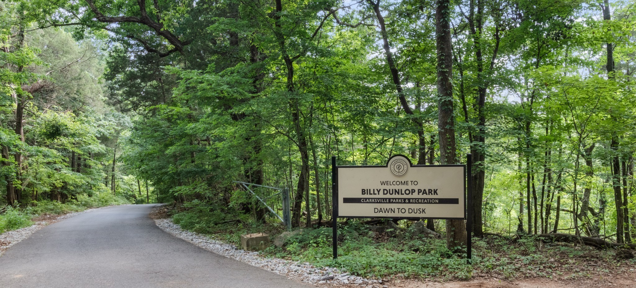 310 Front Ridge Circle Clarksville, TN 37040 - Photo 28 of 35 a sign board with a bench in a forest