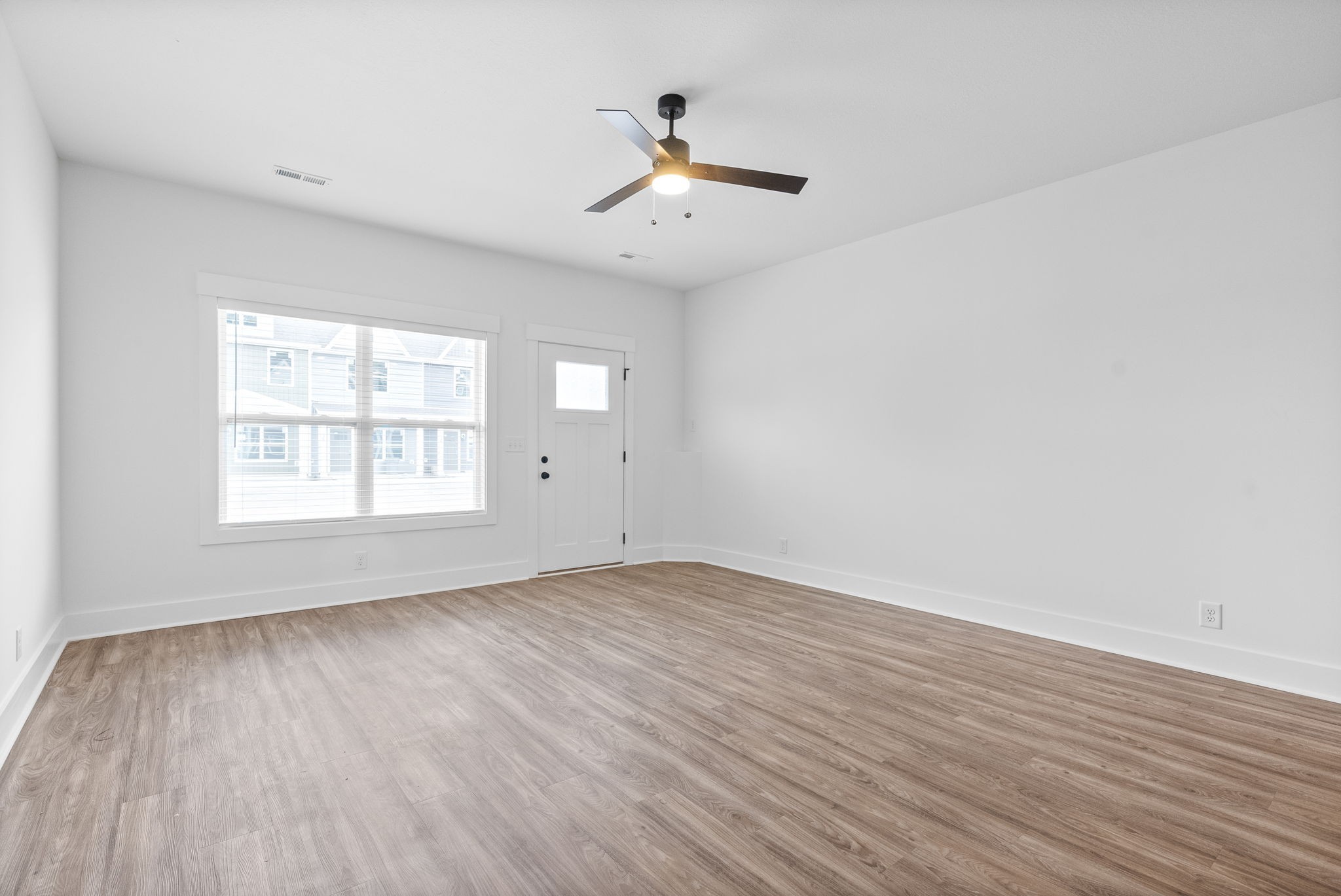 310 Front Ridge Circle Clarksville, TN 37040 - Photo 3 of 35 an empty room with wooden floor and windows