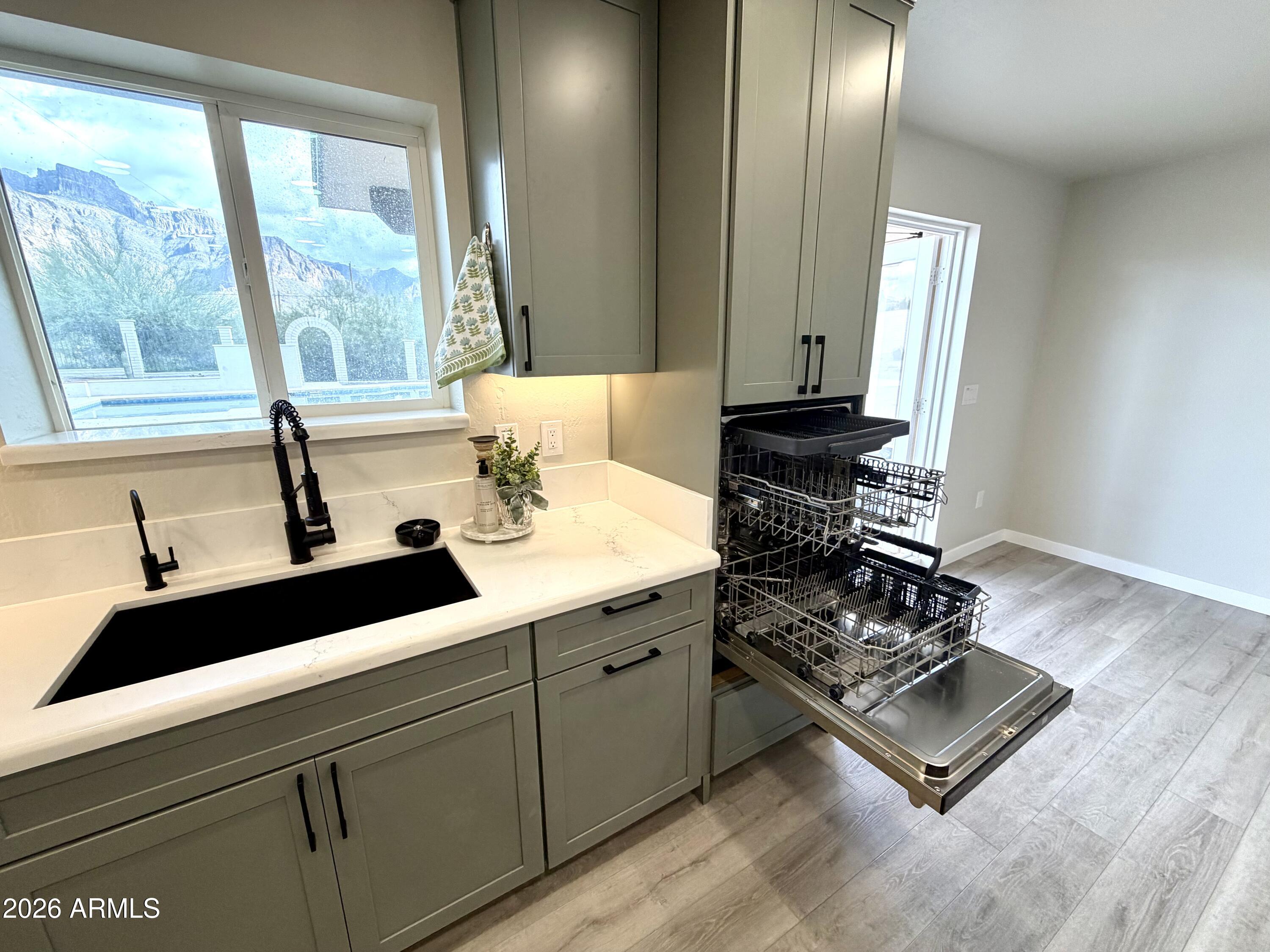 1165 North Mountain View Road Apache Junction, AZ 85119 - Photo 5 of 29 a kitchen with a sink appliances and a window