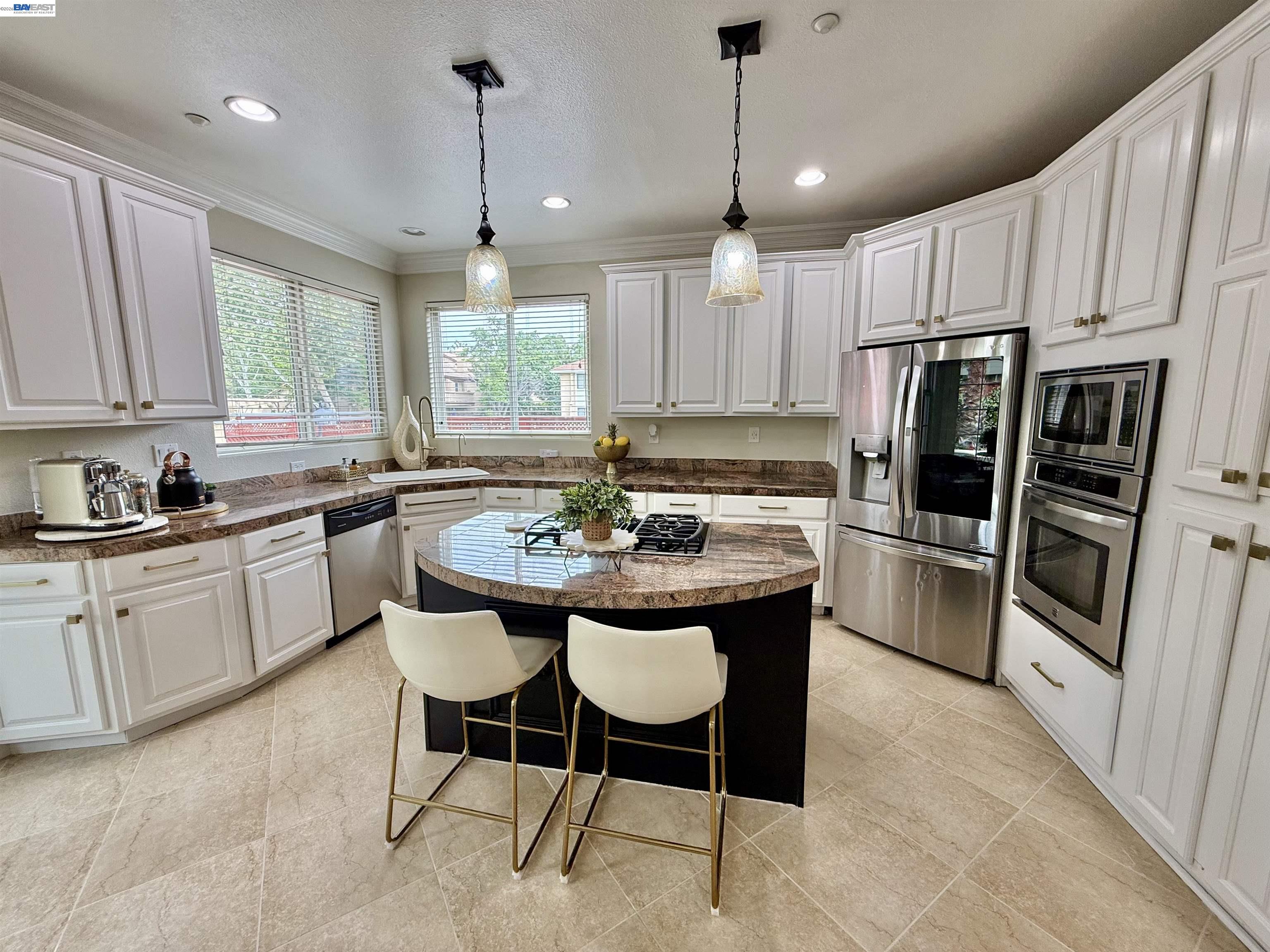 1284 Riesling Circle Livermore, CA 94550 - Photo 18 of 79 a kitchen with refrigerator cabinets dining table and chairs