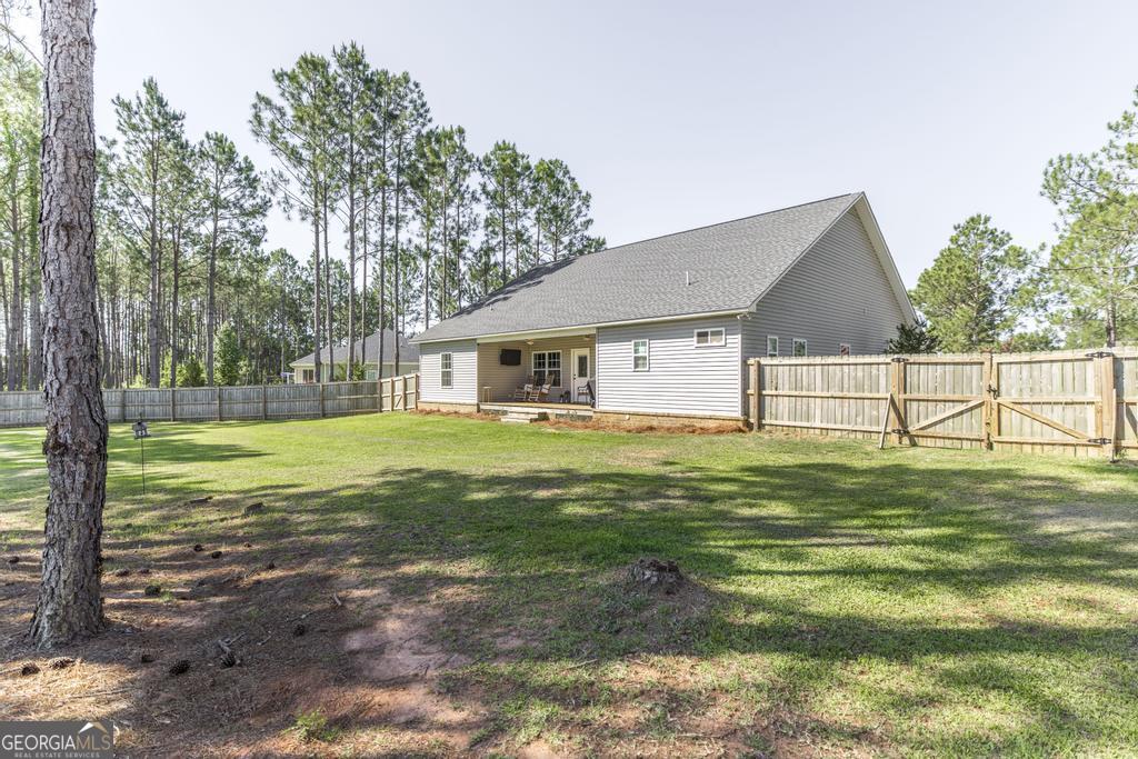 609 Live Oak Way Dublin, GA 31021 - Photo 32 of 37 a view of a house with a yard