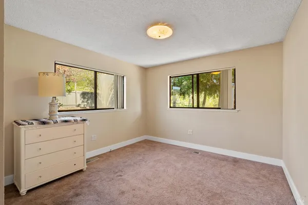 a view of room with cabinet and window