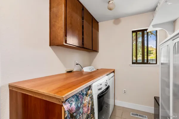 a utility room with washer and dryer