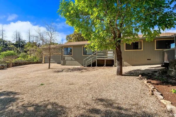 a view of a backyard of the house