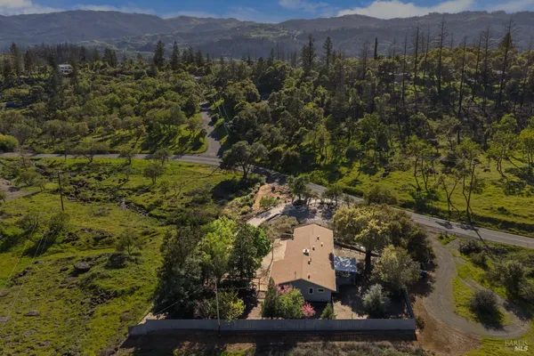 an aerial view of residential house with parking space