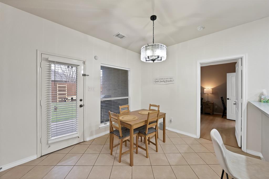 3822 Spring Run Lane Melissa, TX 75454 - Photo 18 of 39 a view of a dining room with furniture and chandelier
