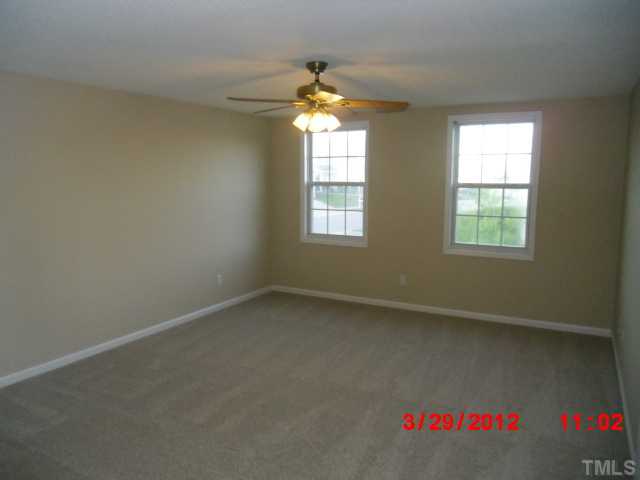 4713 Mocha Lane Raleigh, NC 27616 - Photo 5 of 8 an empty room with a window