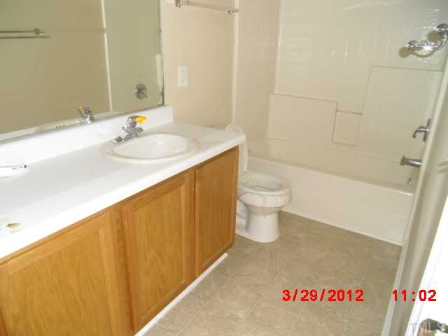 4713 Mocha Lane Raleigh, NC 27616 - Photo 6 of 8 a bathroom with a sink and a toilet